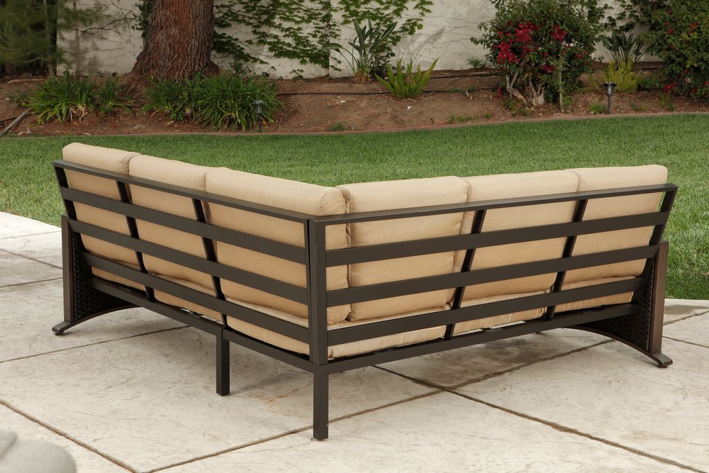 Two Piece Brown and Tan Metal Sectional Seating Group With Table
