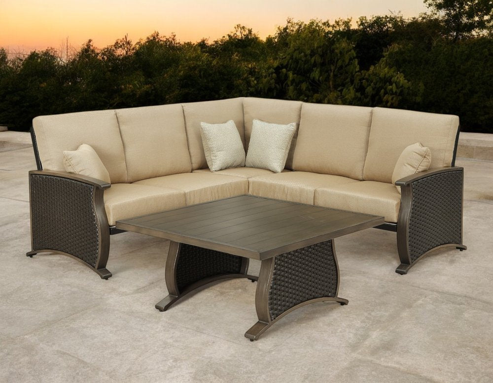 Two Piece Brown and Tan Metal Sectional Seating Group With Table