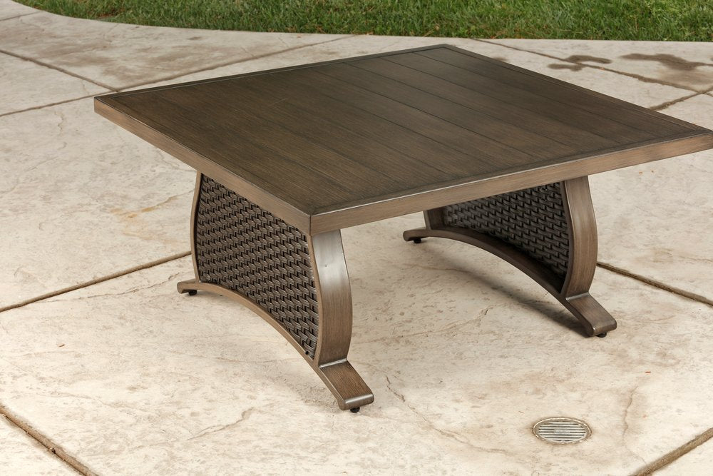 Two Piece Brown and Tan Metal Sectional Seating Group With Table