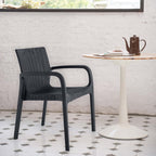Set of Two Black Faux Rattan Heavy Duty Plastic Outdoor Stacking Arm Chairs